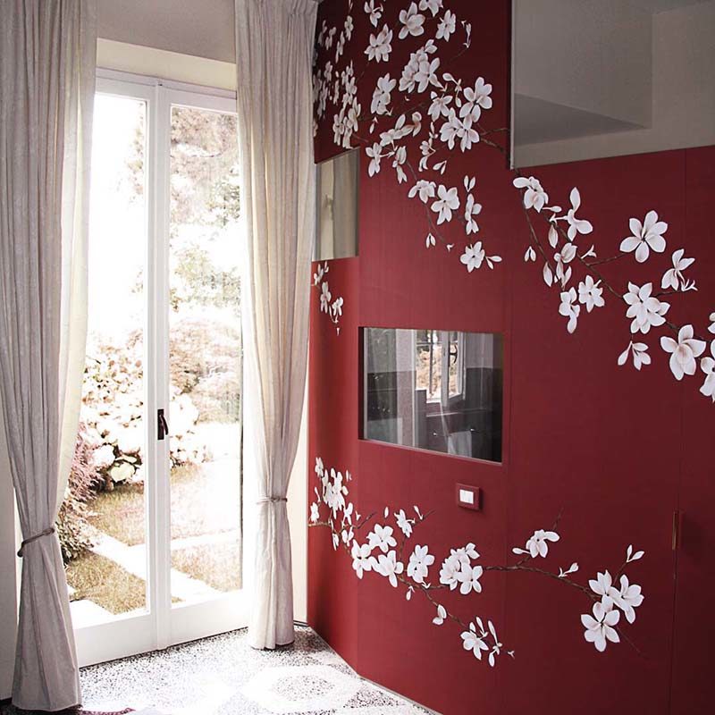 beautiful entrance with red silk wallcoverings combine with white japanese flowers