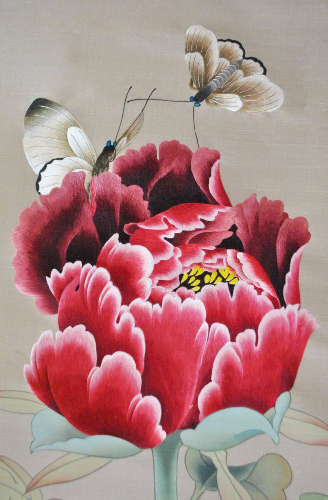 Details of silk threads on a red flower wallcovering